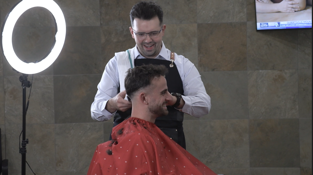 Joey Tesorio cutting hair.