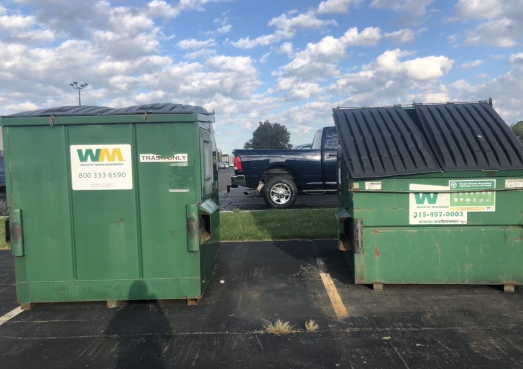 Trash and recyclable dumpsters.