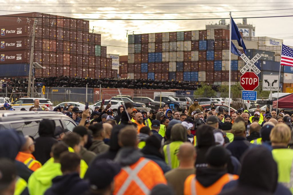 Dockworkers on strike standing outside a port in New Jersey.