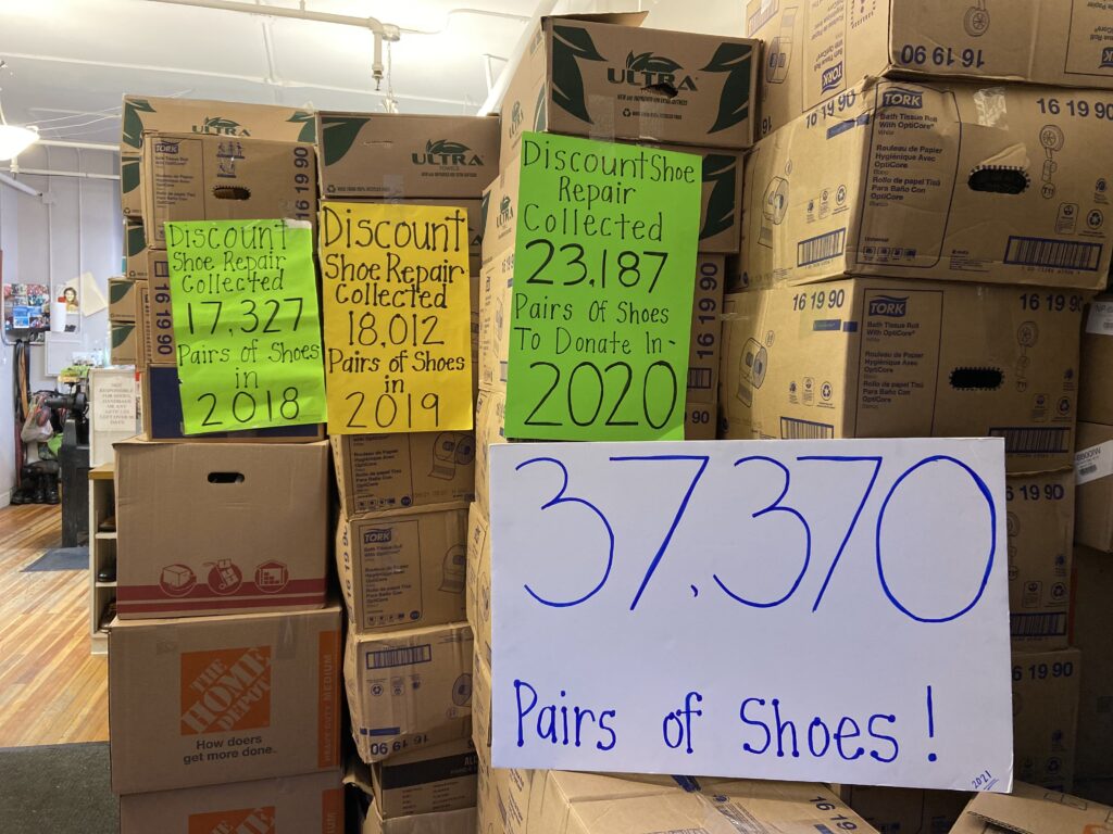 Sign saying 37,000 pairs of shoes donated to homeless.