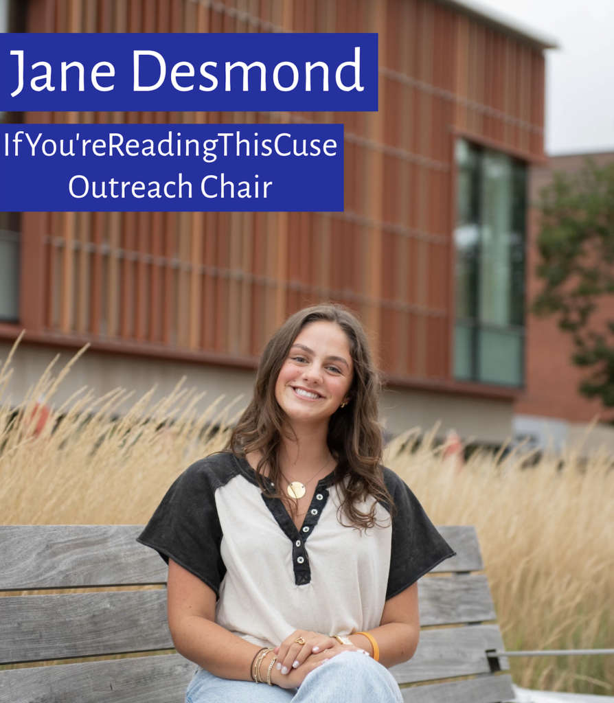 Jane Desmond, Outreach Chair of IfYou'reReadingThis Syracuse sits outside of the Schine Student Center on a bench.