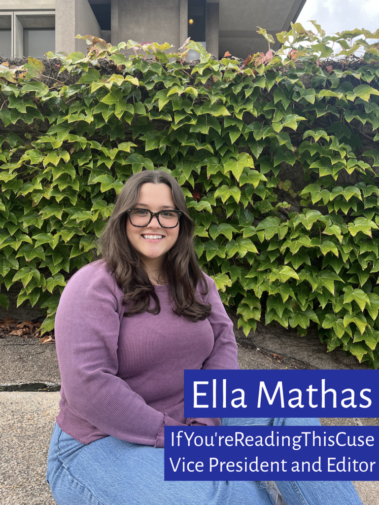 Ella Mathas, Vice President and editor of Syracuse's IfYou'reReadingThis chapter sits outside during an interview in front of an ivy wall.