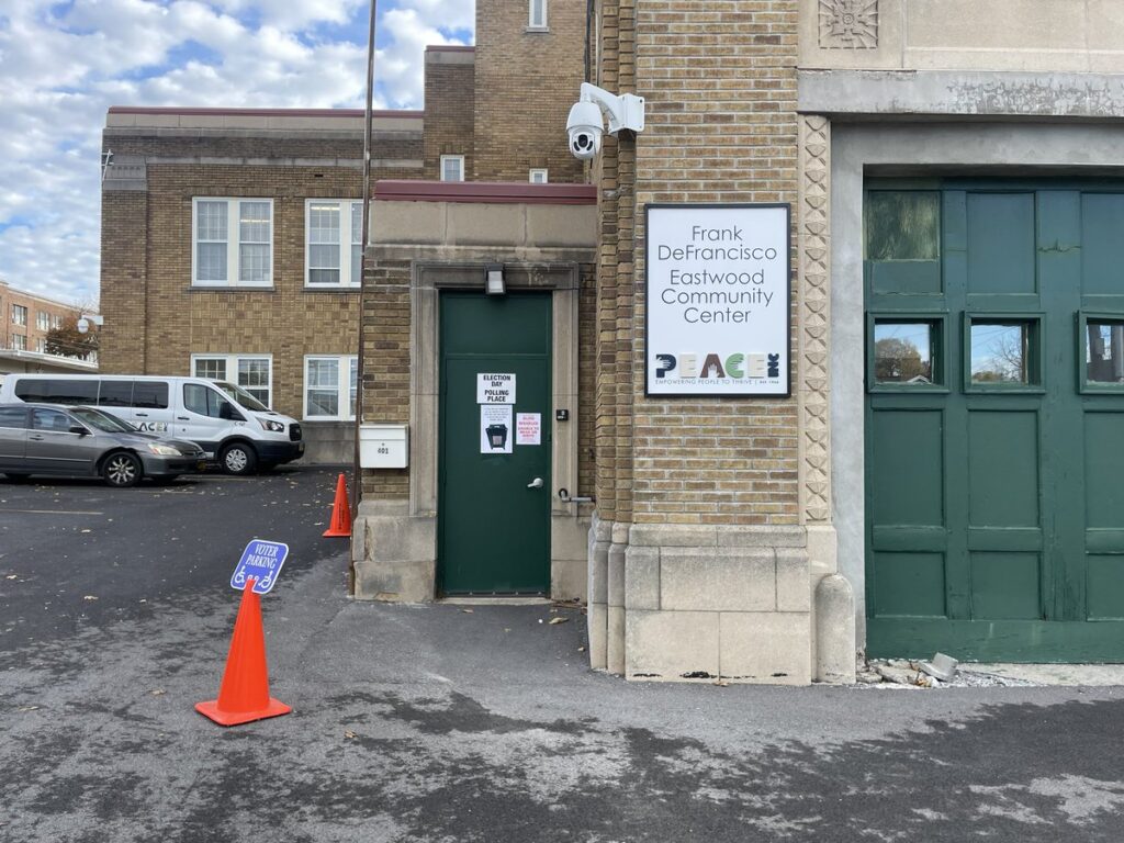 Exterior of the Frank DeFrancisco Eastwood Community Center in Syracuse with voting parking signage