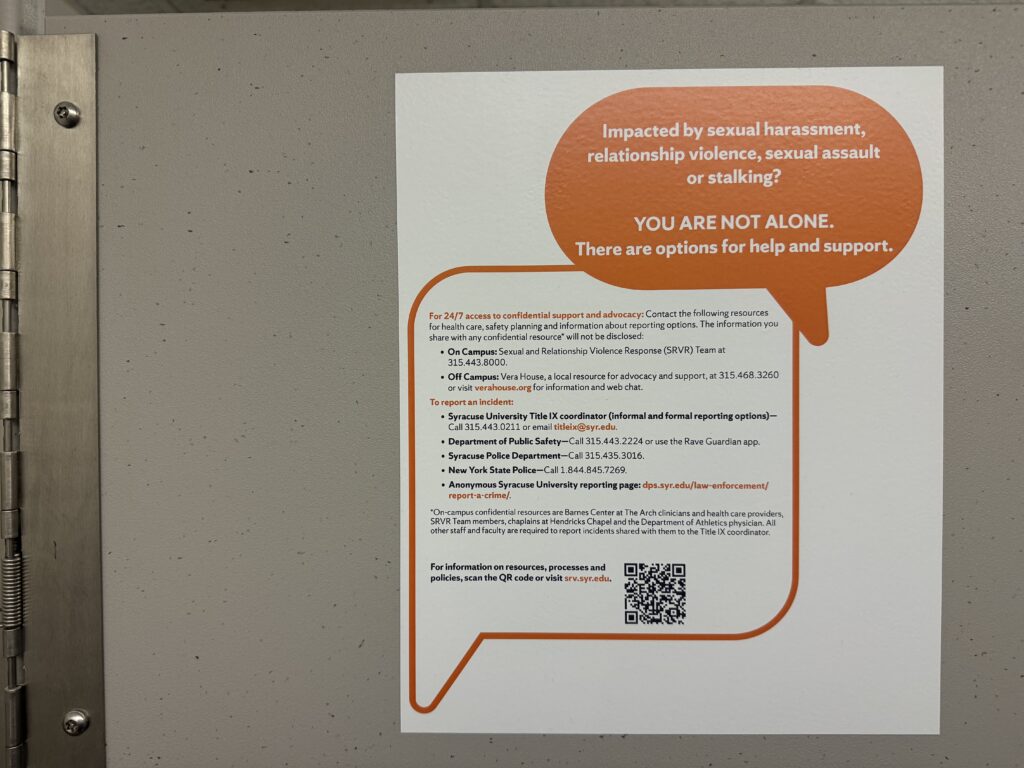 Photo of a flyer on a bathroom stall at SU, outlining resources for those impacted by sexual violence.