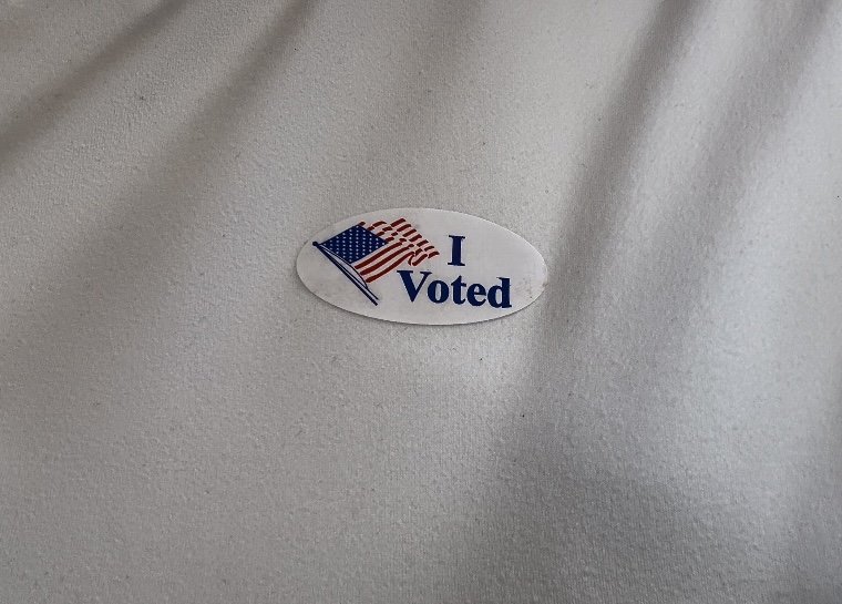 Student's shirt with an "I Voted" Sticker.