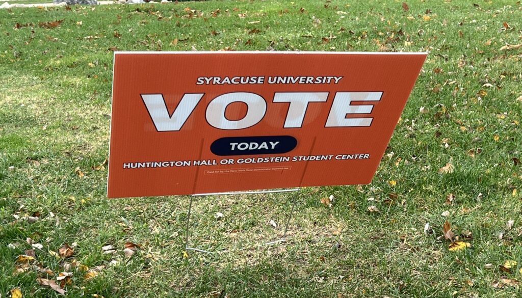 Orange Syracuse Univeristy sign encouraging students to vote © 2024 Alexa LaMalfa