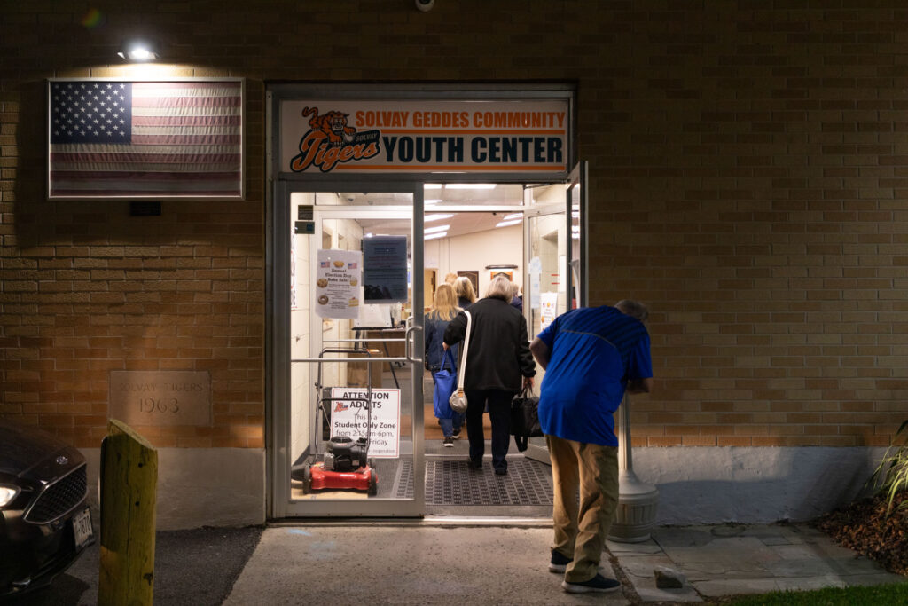 Polling place managers come to the Solvay Geddes Youth Center in the early morning to set up the space and equipment.