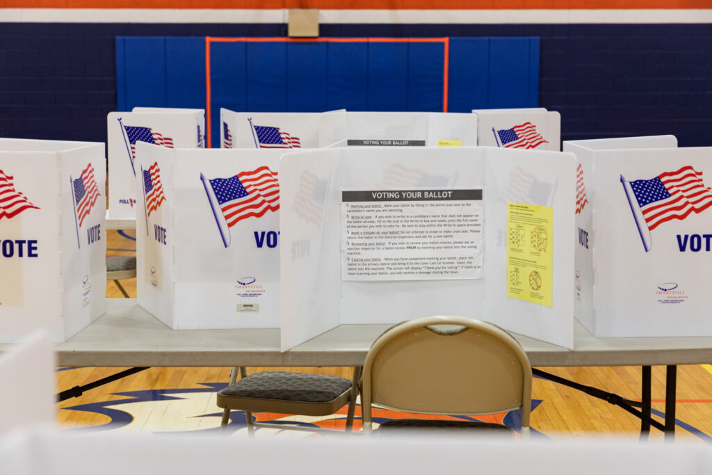 To protect voter privacy, each desk is separated by a baffle.