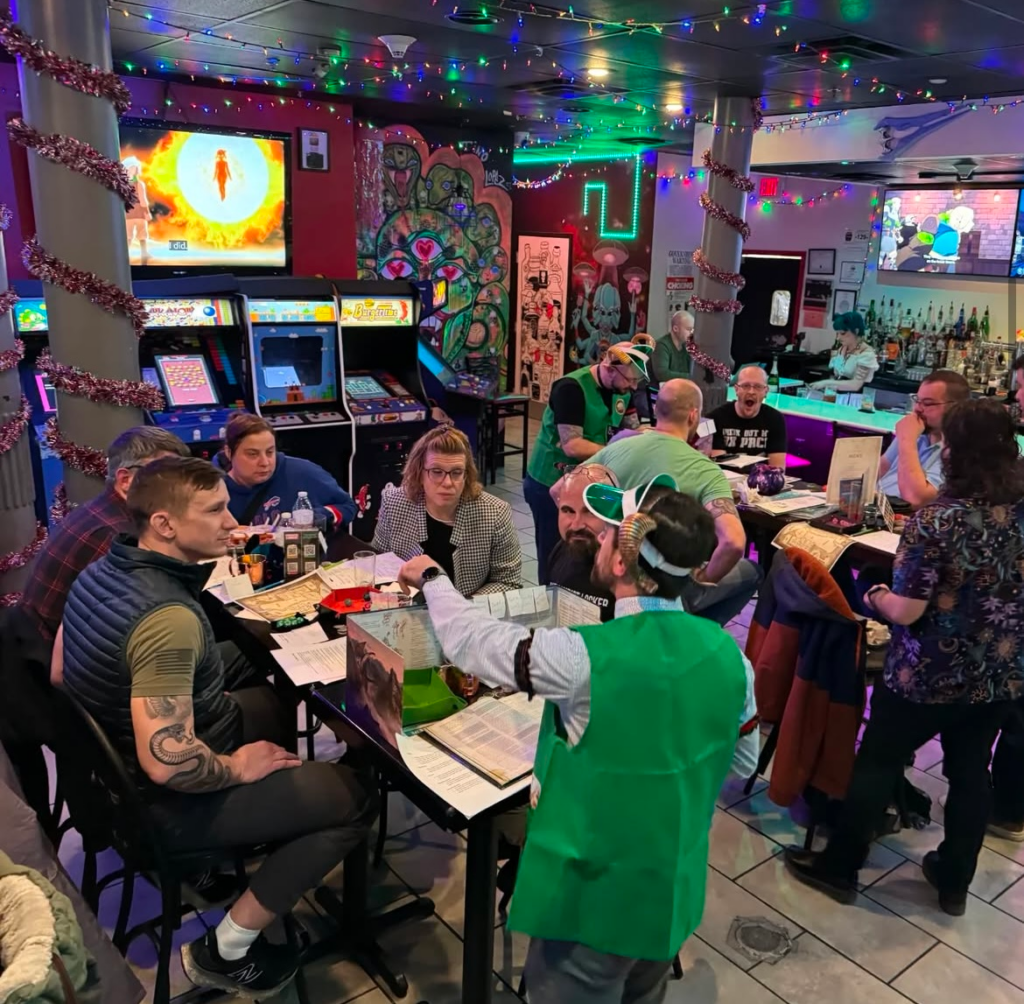 Customers are gathered in a restaurant playing games while eating.