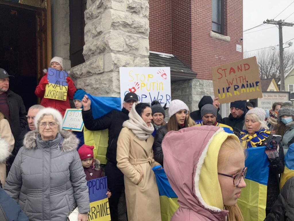 Photo of Ukrainian protestors in front of a church