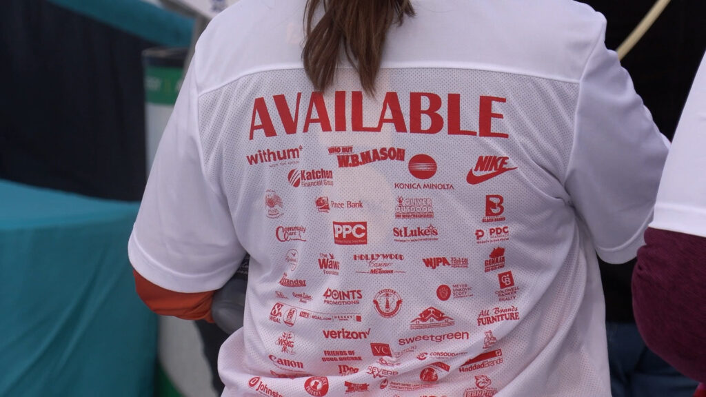 Cupid's Chase 5k white shirt saying "Available" for the match-making portion of the race.