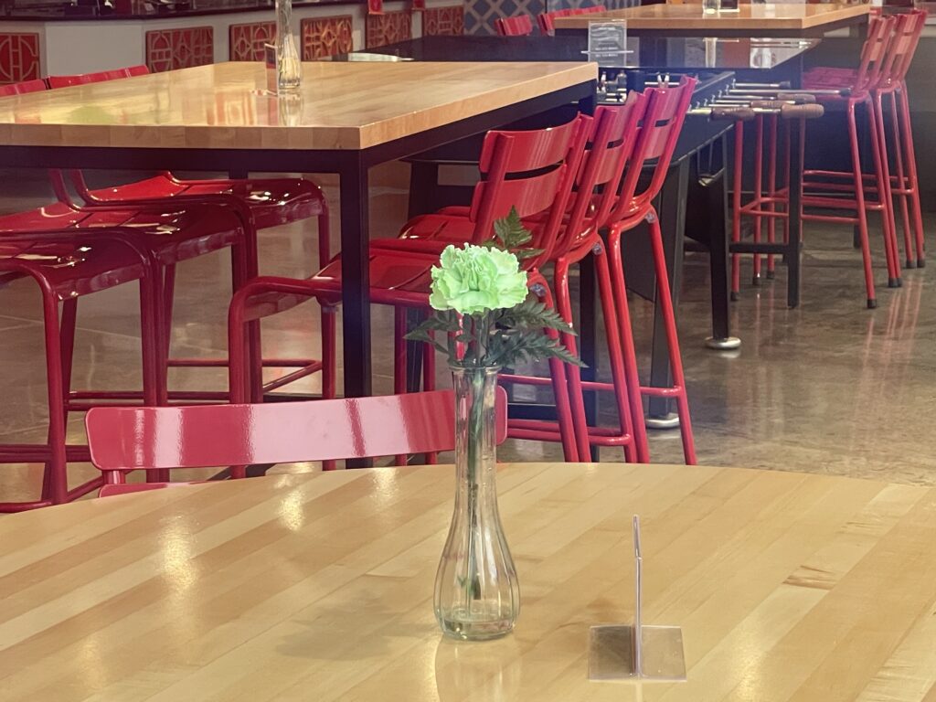 Green flower on the table of the intertior of Salt City Market