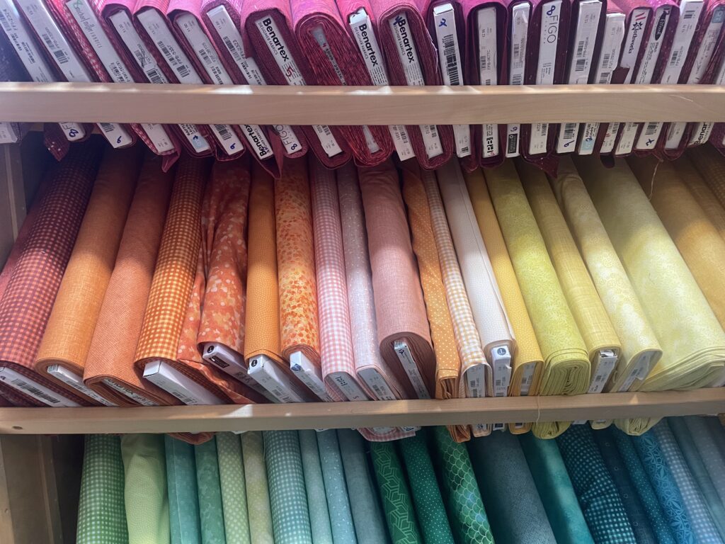 Colorful assortment of fabrics from Calico Gals quilt shop.