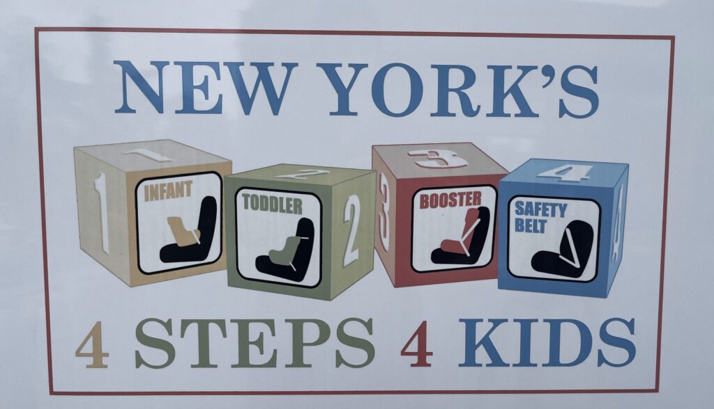 Sign on back of police truck saying 'New York's 4 Steps 4 Kids'