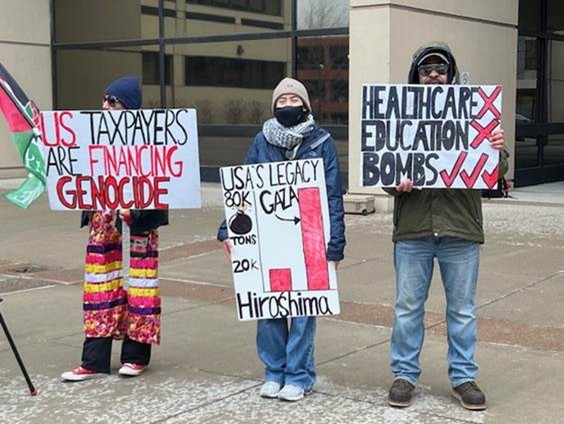 Protesters holding signs