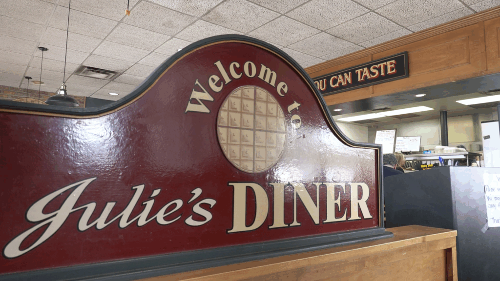 A sign inside the front door of Julie's Diner in North Syracuse that reads "Welcome to Julie's Diner."