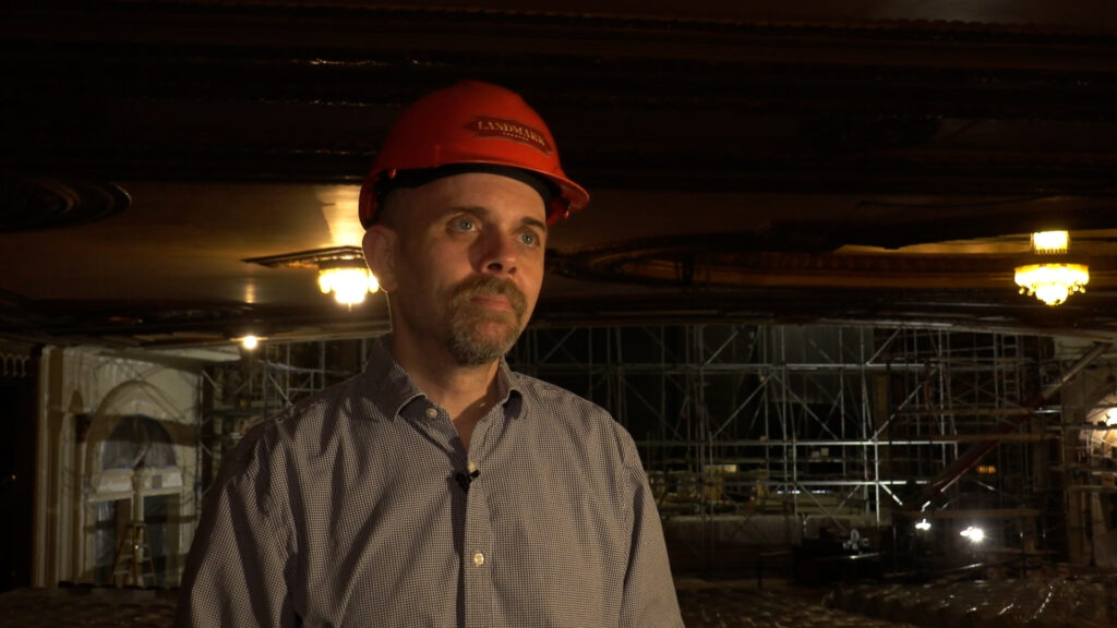 Mike Intaglietta, Executive Director of the Syracuse Landmark Theatre stands among the construction inside the autotorium.