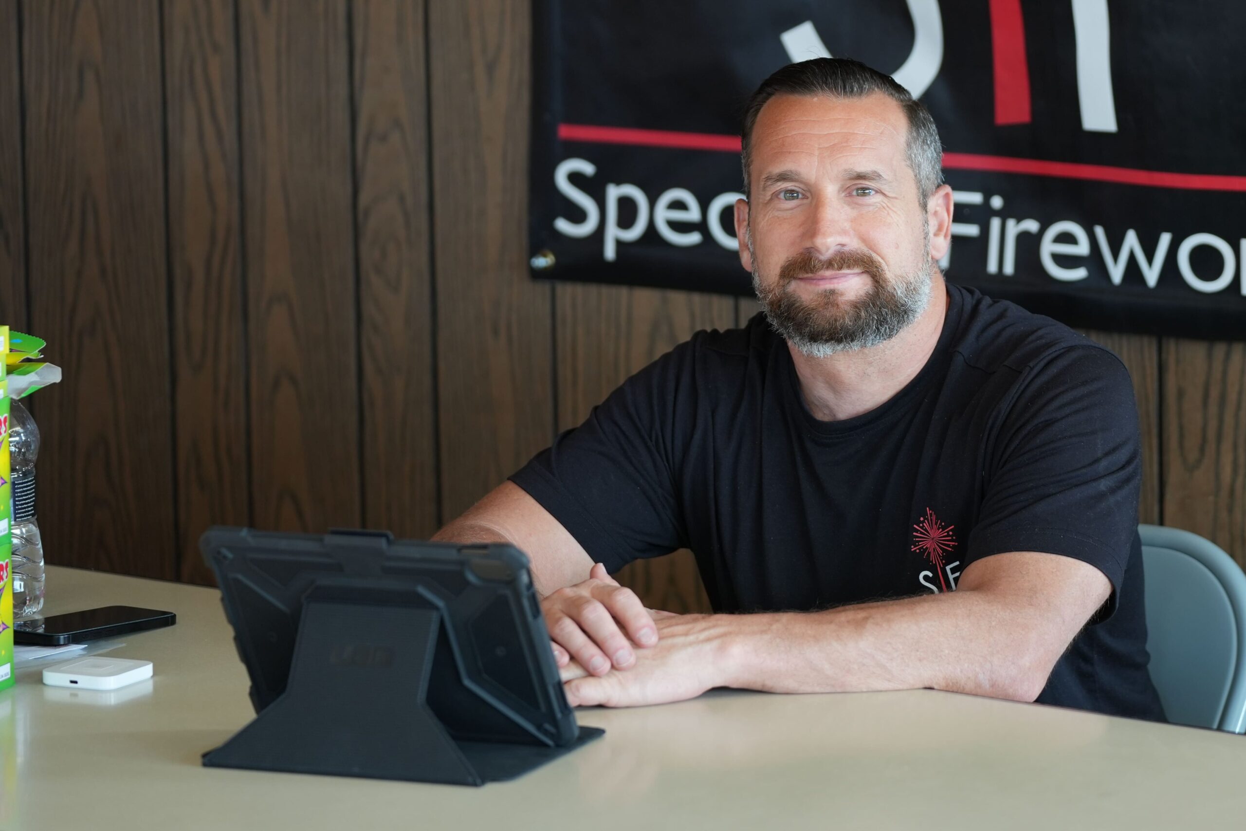 Joe Speciale sits at register inside his Firework store in Utica.