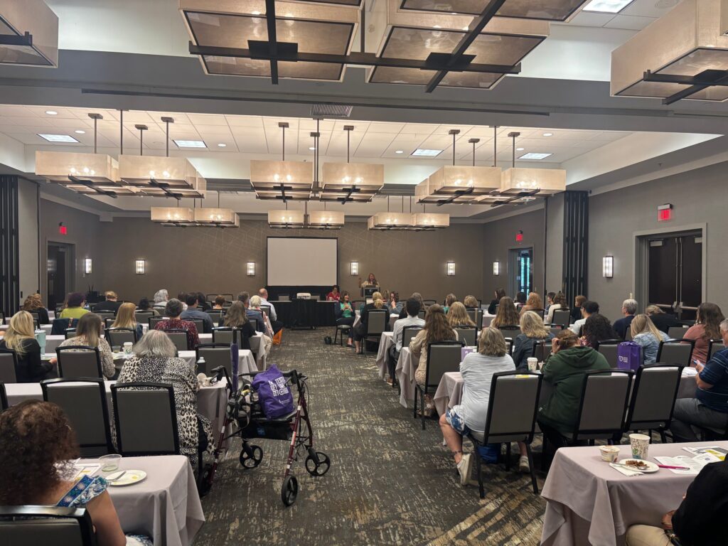 People listening to one of the key speakers about ways to idenitfy Elder Abuse 