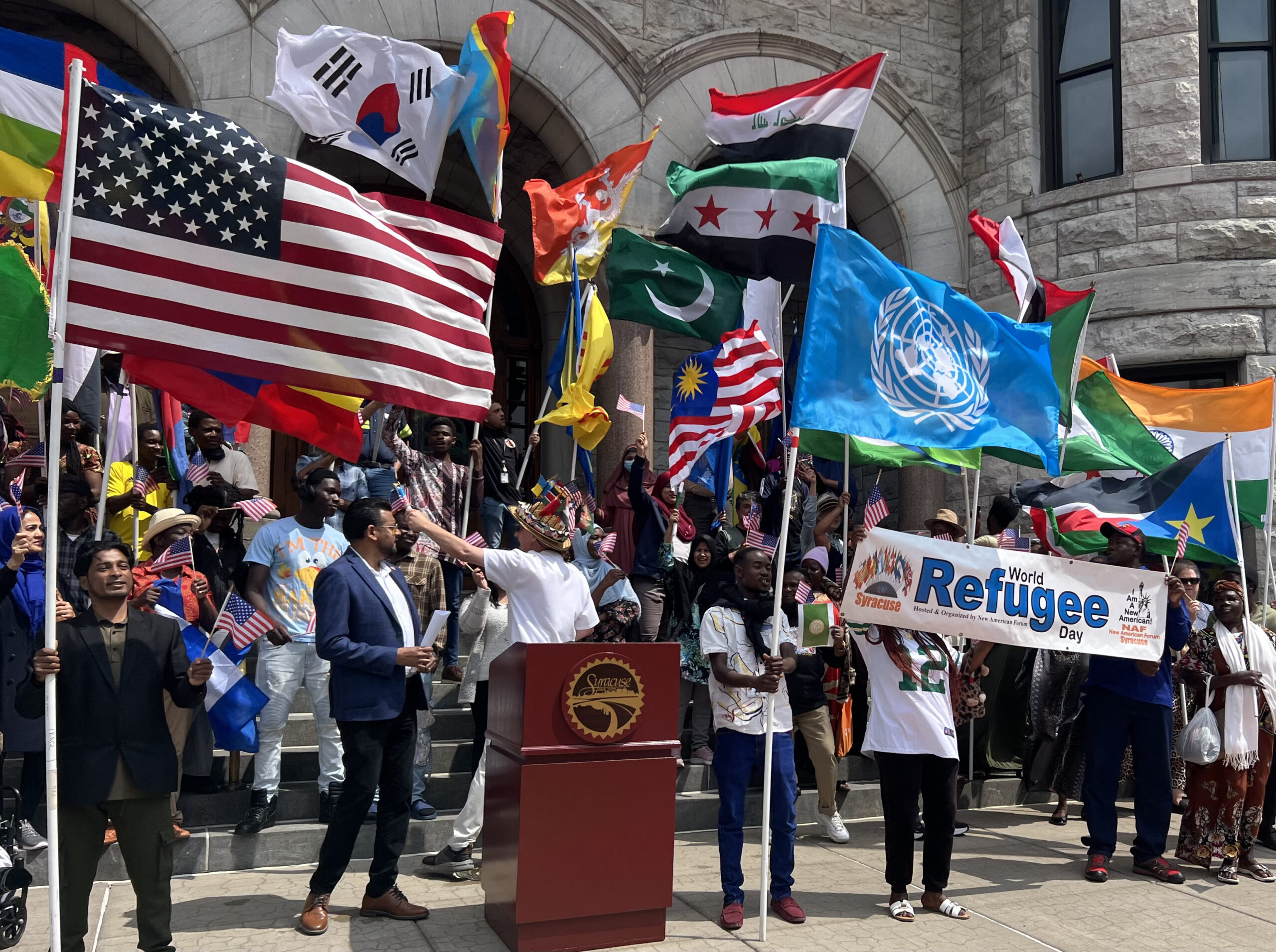 Syracuse celebrates World Refugee Day with flag-raising ceremony - NCC News