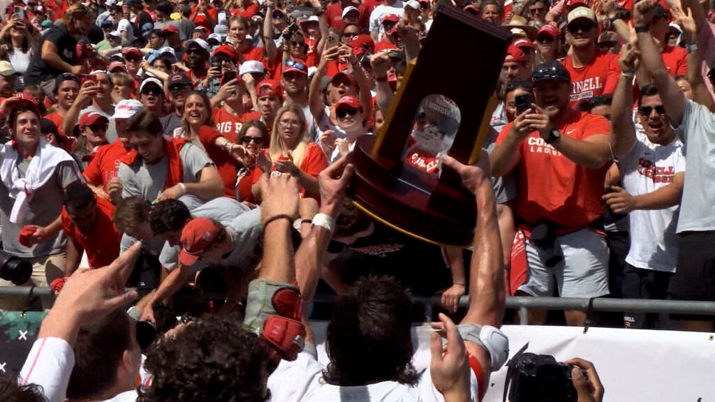 Cornell brings the national championship trophy to the fans. 