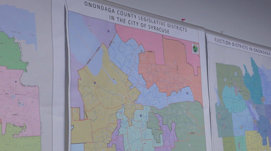Election maps line the wall of the Onondaga County Board of Elections office in Syracuse. About 55,000 city residents are eligible to vote in the upcoming Democratic primary. © 2025 Maria Wainscott