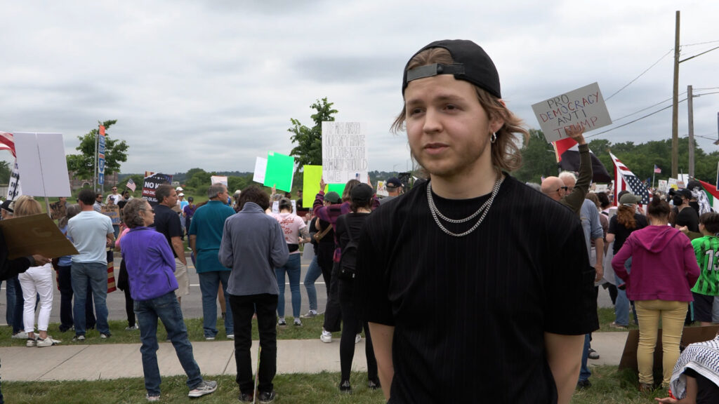 Damon Rowe answers questions about why he attended the protest.