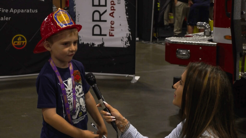 A young attendee at FIRE 2025 shares his future plans with NCC News reporter Maria Wainscott. © 2025 Maria Wainscott