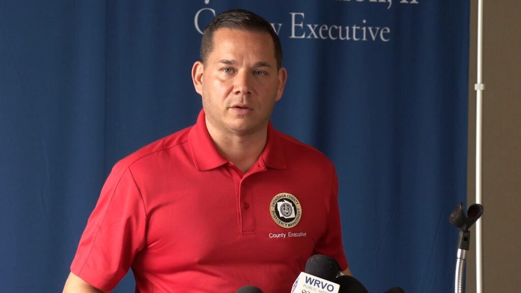 Onondaga Couny Executive Ryan McMahon at a podium speaking at a press conference.