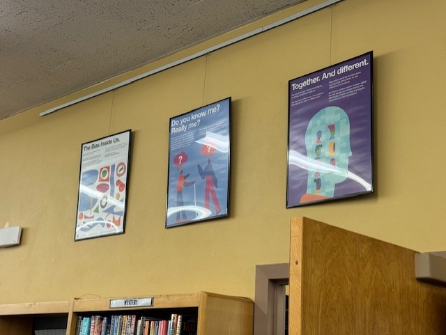 Some of the posters that feature conversation starting questions about bias.