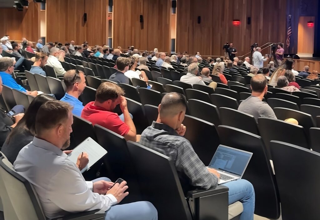 Central New Yorkers sitting in the auditorium during Micron's public hearings at Liverpool High School on July 24.