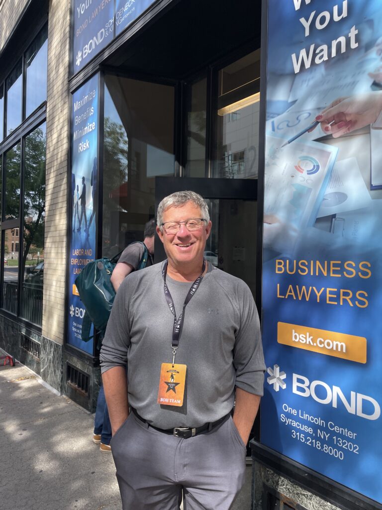Marc Albert stands outside of the offices at the Landmark Theatre.