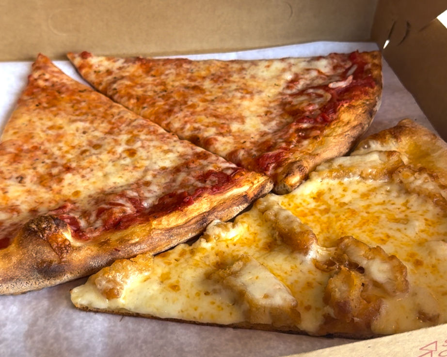 Two slices of cheese pizza and one slice of buffalo chicken.