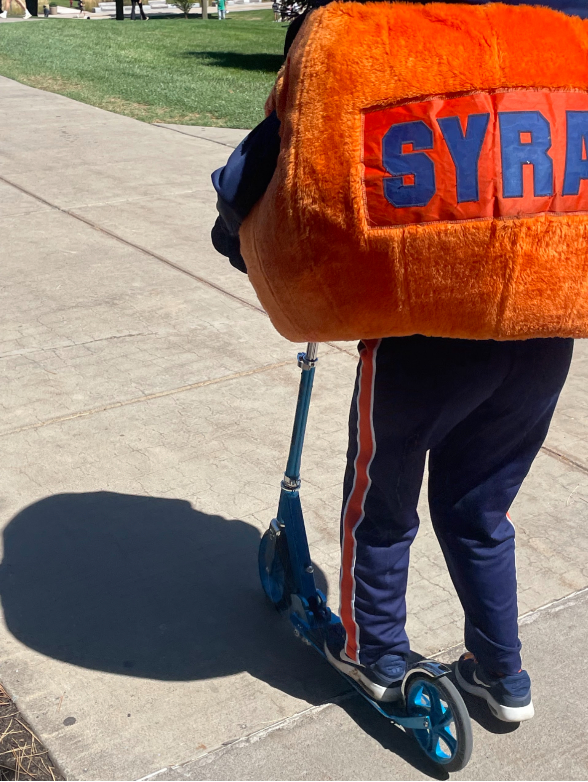 Otto scooters around camus.