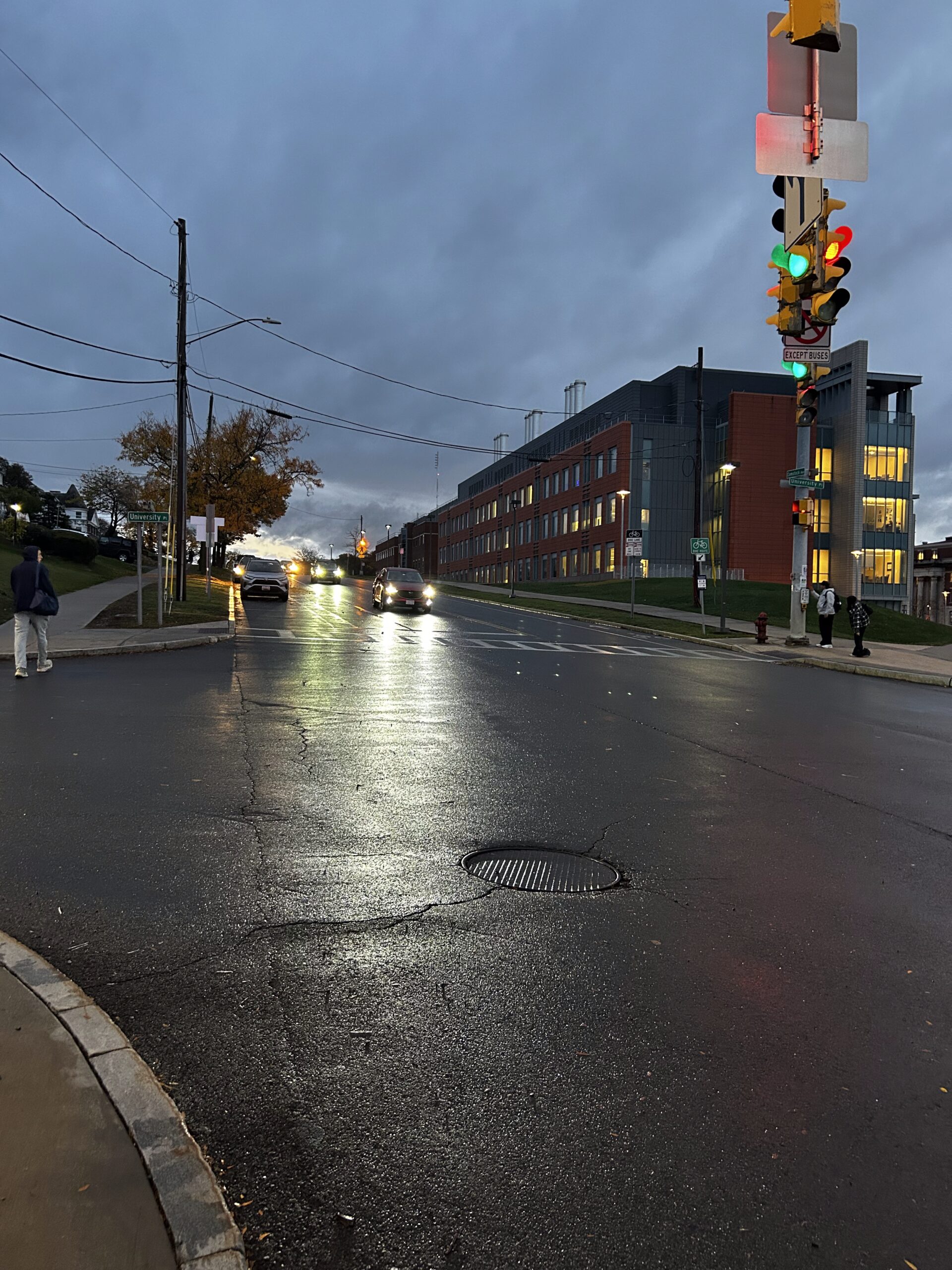 A Syracuse street with cars driving by