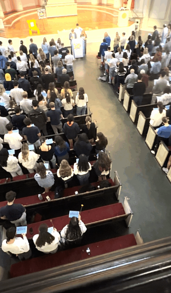 Wide shot of the Vigil showing the students and staff in attendence and the lectern where speaches were given.