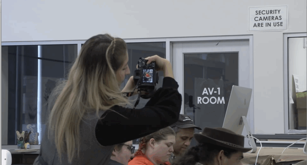 Woman taking a photo with camera