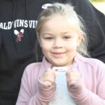 Young voter-in-training: Baldwinsville girl joins parents at the polls