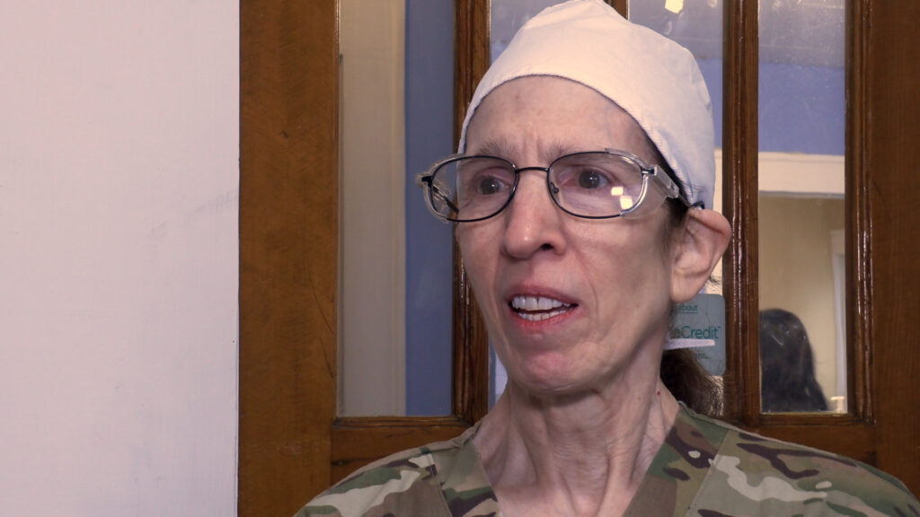 Dr. Joan Laura dresses in camouflage to honor veterans on Veteran's Day.