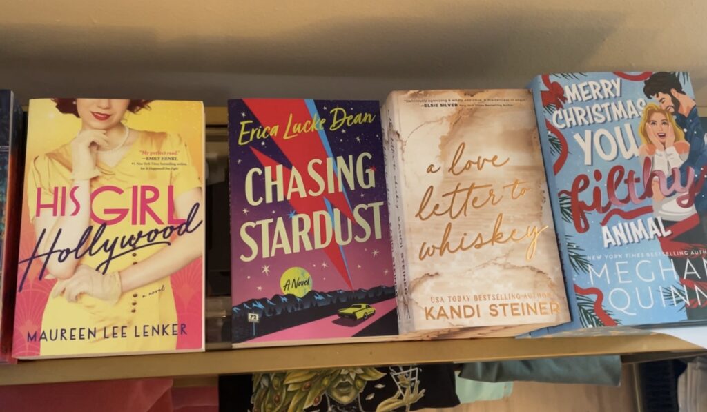 Four books in a row of varying colors