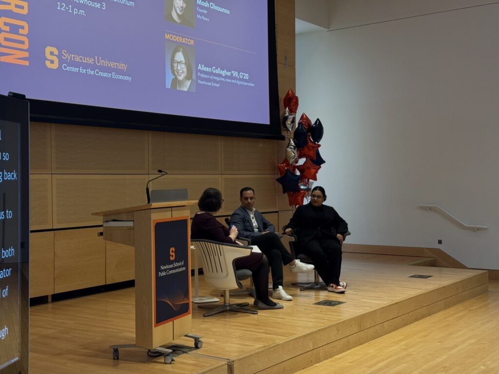 Panelists sit at Creator Con