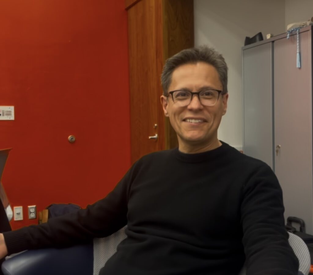 Mauricio Paredes sits in the Syracuse Abroad office in Bird Library after the panel "Empanadas and Chile."