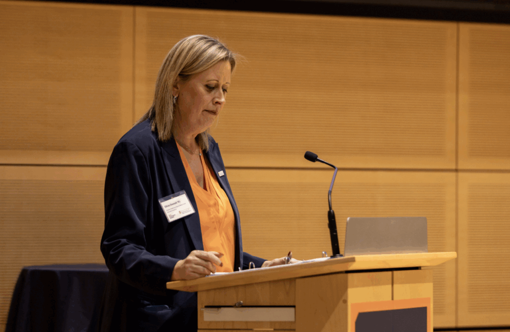 Professor and Sports Media Director Olivia Stomski Presenting Award