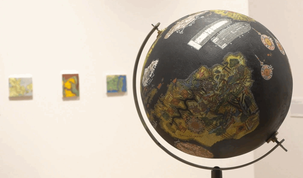 A dark blue globe with stylized landmasses depciting historical struggles.