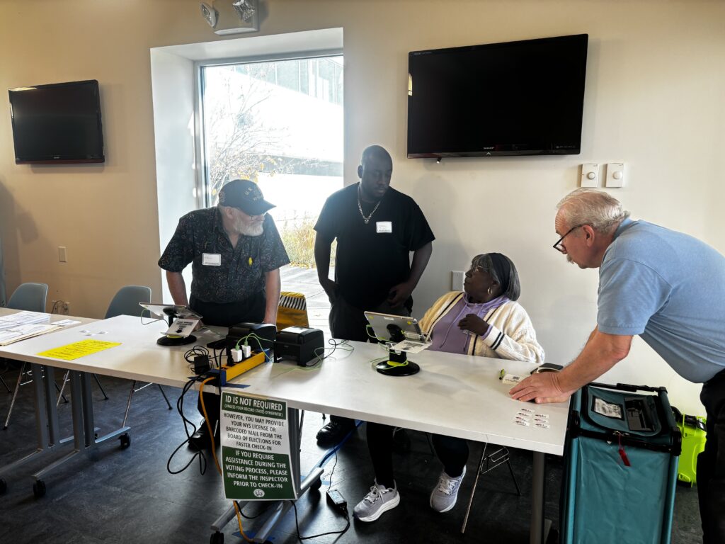 Polling managers at the WCNY-TV polling place