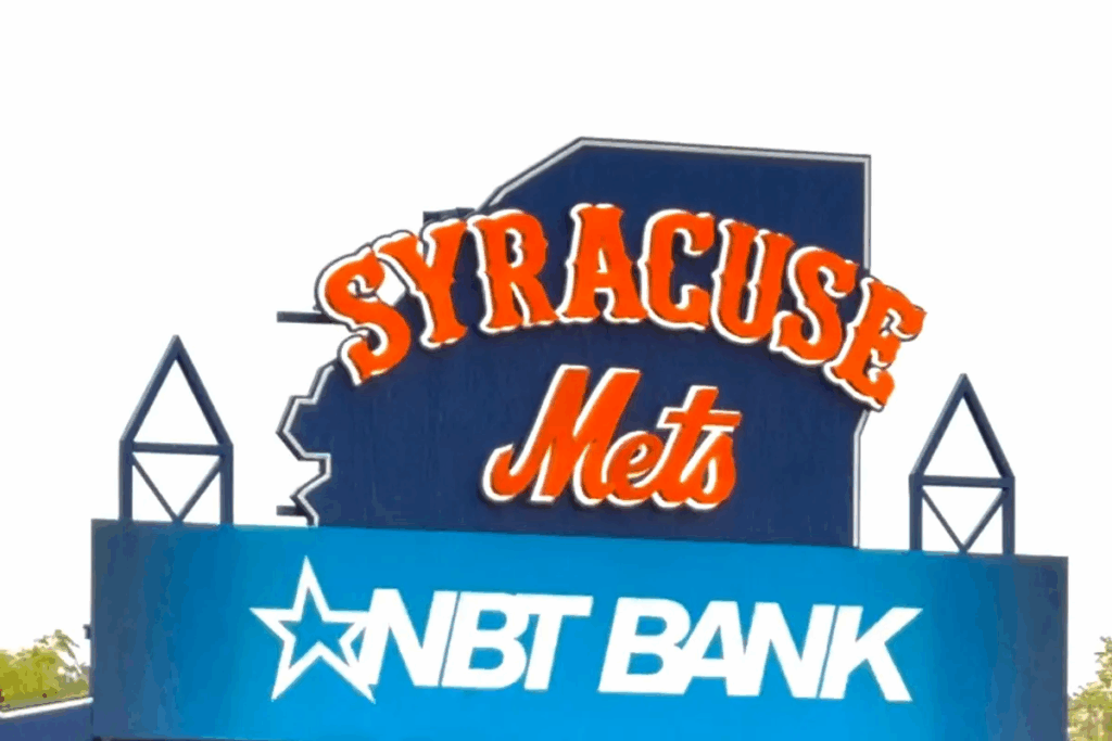 An image of the NBT Bank Stadium jumbotron that holds a Syracuse Mets Logo on top.