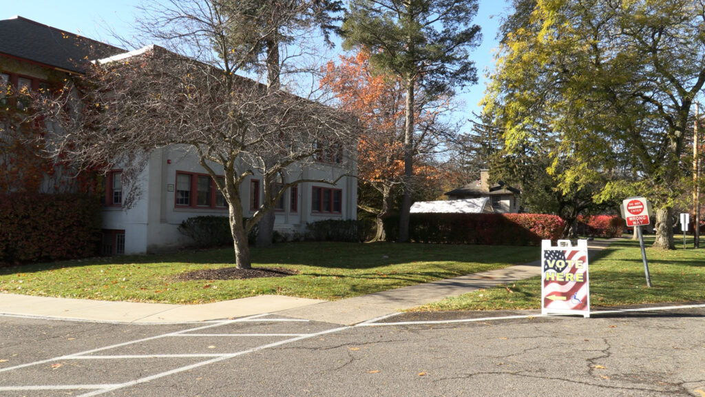 A “Vote Here” sign stands in front of the Elmcrest Children's Center in the Eastside of Syracuse, directing residents to a polling site on Election Day in Onondaga County. 