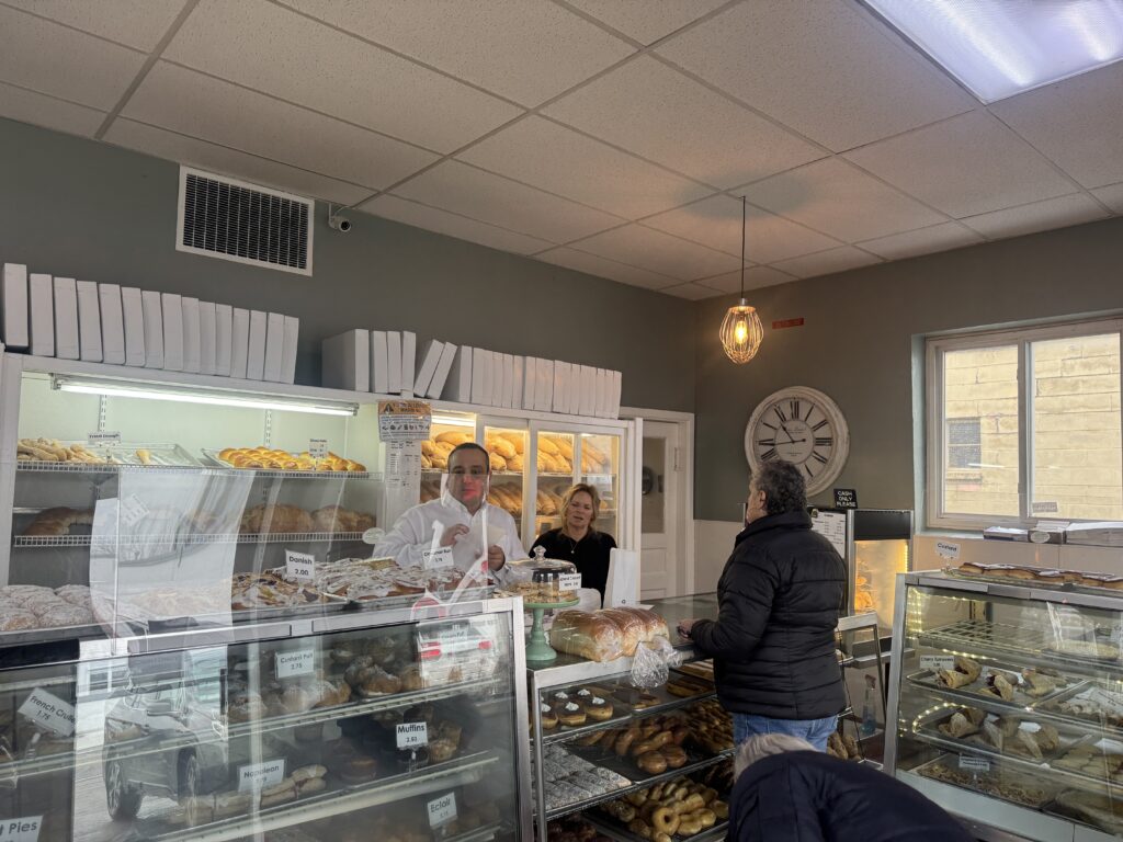Dawn Mignacca serving customers at her Lyncourt Bakery.