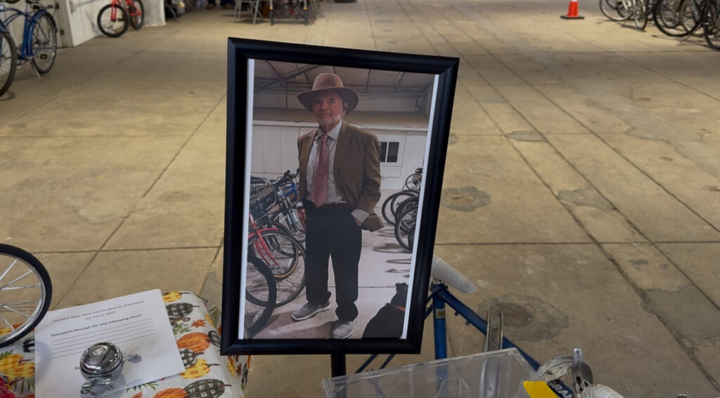 At the front of the warehouse the giveaway volunteer team honor their late founder