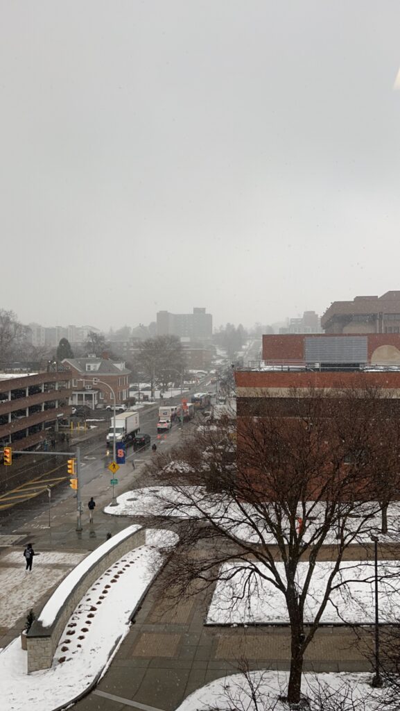 Waverly Avenue from inside Syracuse University's Newhouse School on a winter's day